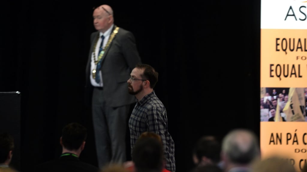 ASTI Fermoy branch member Richard Terry, who complained of members being ‘left out in the cold’, is instructed to leave the podium after exceeding his speaking time. Photograph: Don MacMonagle