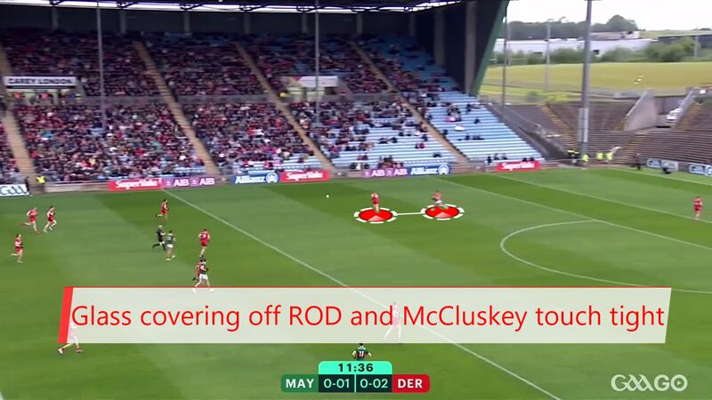 Conor Glass covering space in front of Ryan O’Donoghue while Conor McCluskey marks tightly