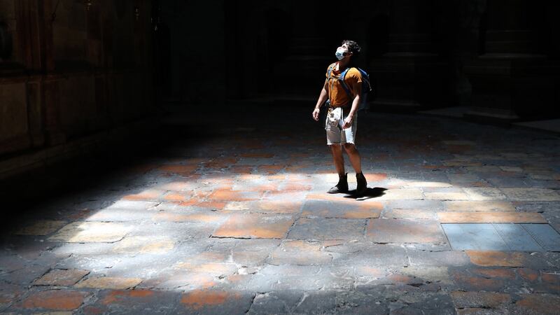 A visitor wearing a face mask stands inside the Church of the Holy Sepulchre in the Old City of Jerusalem on July 15th. Photograph: Abir Sultan/EPA
