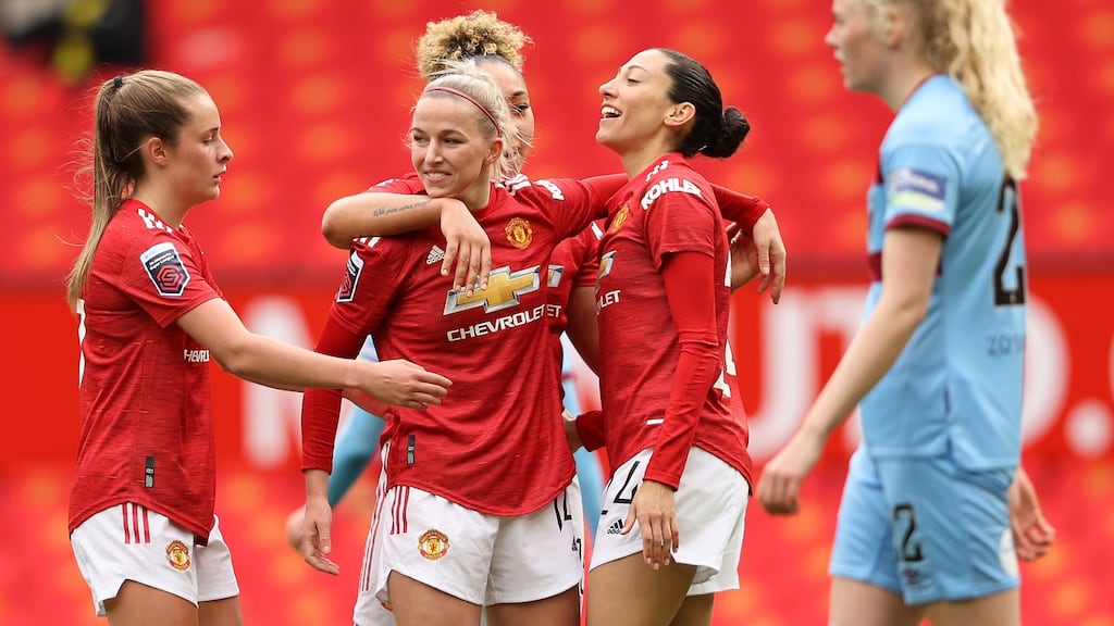 Christen Press, right, of Manchester United celebrates with teammates Ella Toone, Jackie Groenen and Lauren James after scoring against West Ham at Old Trafford. Photograph: Clive Brunskill/Getty Images