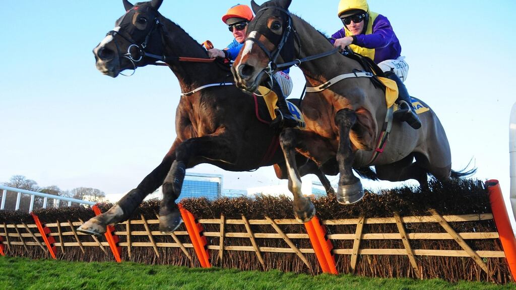 Mick Jazz and Davy Russell (left) en route to winning the Ryanair Hurdle at Leopardstown after favourite Faugheen pulled up. Photograph: PA Wire