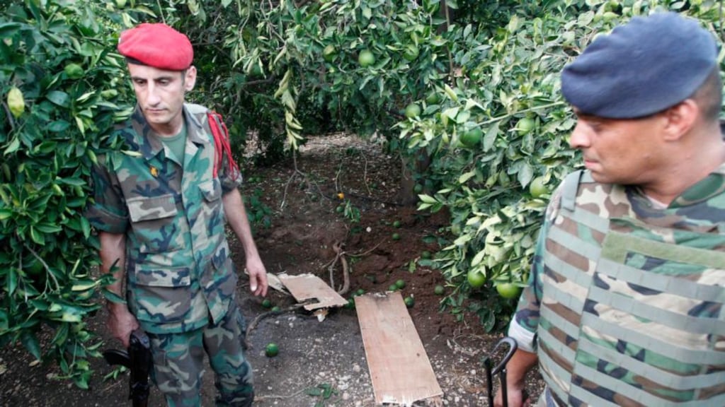 Lebanese soldiers stand near the area where rockets were launched from southern Lebanon into Israel, at Housh, Tyre, yesterday. Photograph: Ali Hashisho/Reuters