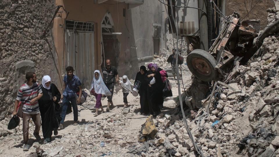 Iraqi civilians flee as Iraqi special forces move toward Islamic State positions in the Old City of Mosul. Photograph: Felipe Dana/AP