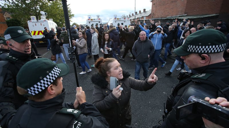 Residents of the nationalist Ardoyne district in north Belfast argue with police officers after an Orange Order parade passed along the Crumlin Road. Photograph: Niall Carson/PA Wire