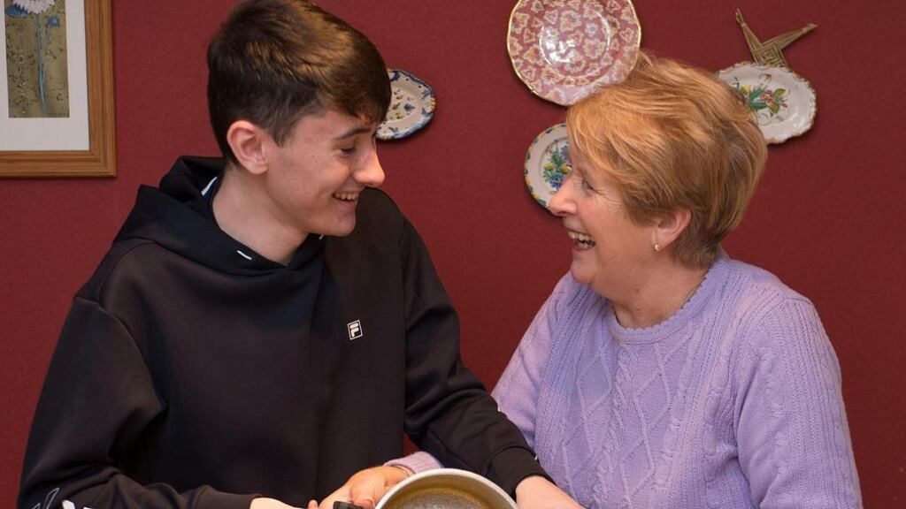Ann Fleming and her eldest grandchild Cian Domican, making Christmas pudding.Photograph: Dave Meehan for The Irish Times