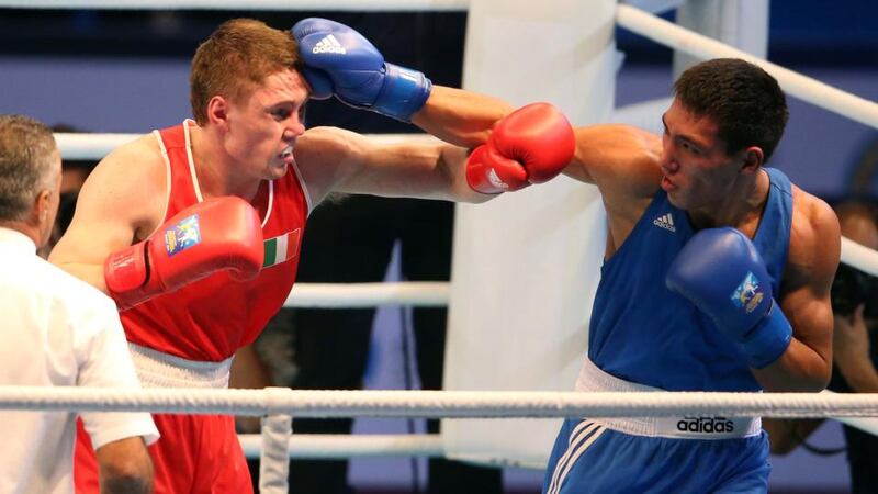 Jason Quigley in action against Zanibek Alimkhanuly during the Middleweight final. Photograph: Cathal Noonan/Inpho