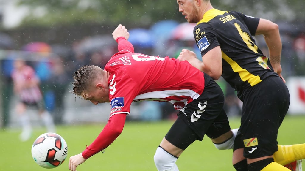 Derry’s Ronan Curtis is challenged by Sligo’s Seamus Sharkey at Maginn Park. Photograph: Lorcan Doherty/Inpho