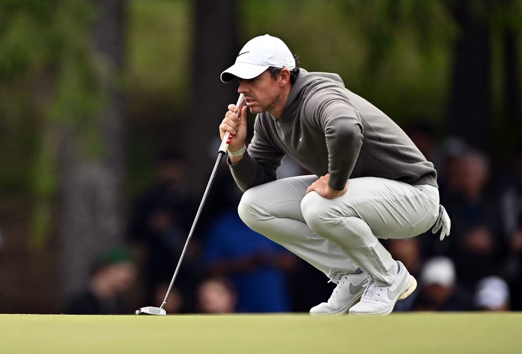 Rory McIlroy of Northern Ireland lines up a putt on the 3rd hole during the first round of the RBC Canadian Open at Oakdale Golf & Country Club. Photograph: Minas Panagiotakis/Getty