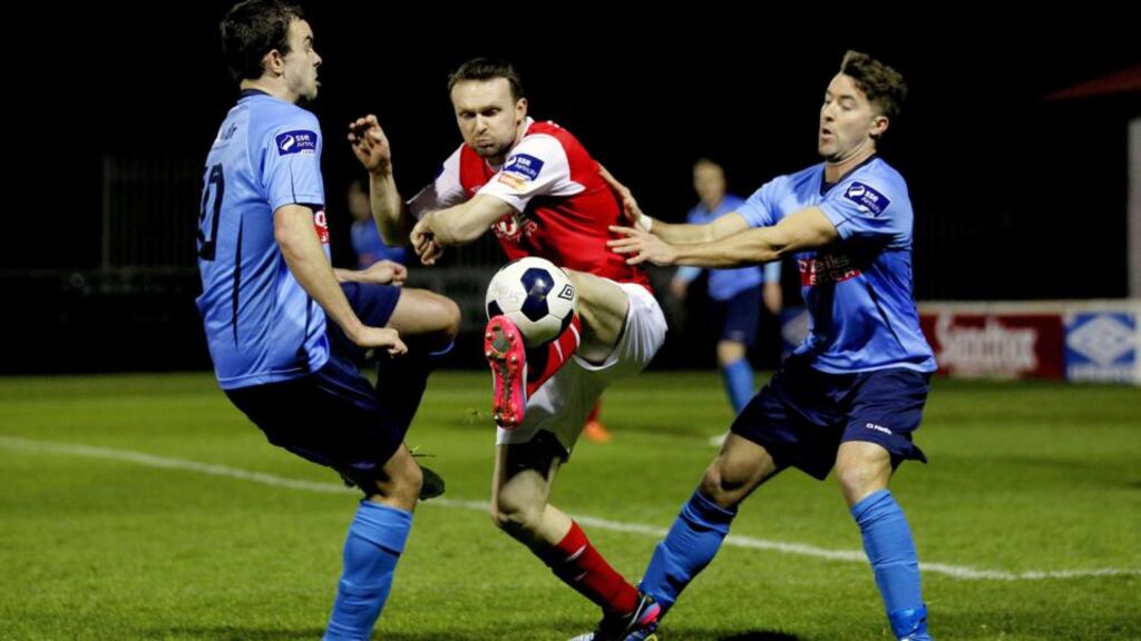 Conan Byrne of St Patrick’s Athletic with Robbie Benson and Mark Langtry of UCDat richmond Park. Photograph: Ryan Byrne/Inpho