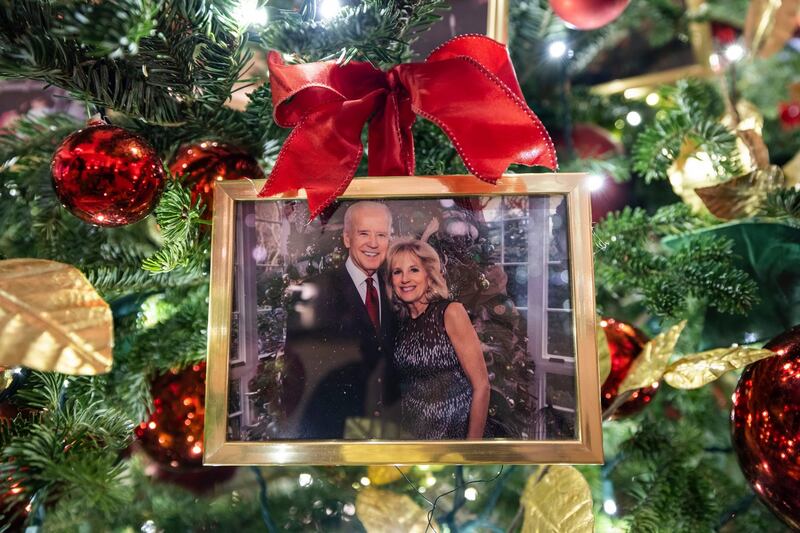 White House Christmas: a photo of President Joe Biden and First Lady Jill Biden hangs from a tree in the State Dining Room. Photograph: Jim Lo Scalzo/EPA