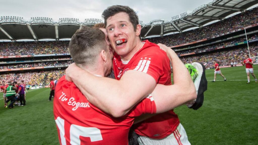 Seán Cavanagh celebrates Tyrone’s victory over Monaghan with team-mates. Photograph: James Crombie/Inpho