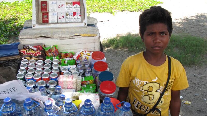 Water boy: Okto, a 14-year-old street trader in Dili. Photograph: Rosie Nic Cionnaith