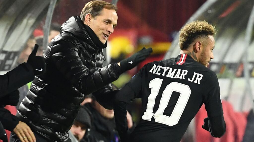 Paris Saint-Germain’s Brazilian forward Neymar is congratulated by   coach Thomas Tuchel after scoring a goal during against Red Star Belgrade  in Belgarde earlier this month. Photograph: Franck Fife/AFP