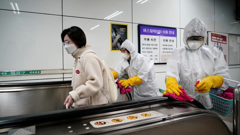 Employees from a disinfection service company sanitize a subway station in Seoul, South Korea, on Friday. Photograph: Kim Hong-Ji/Reuters