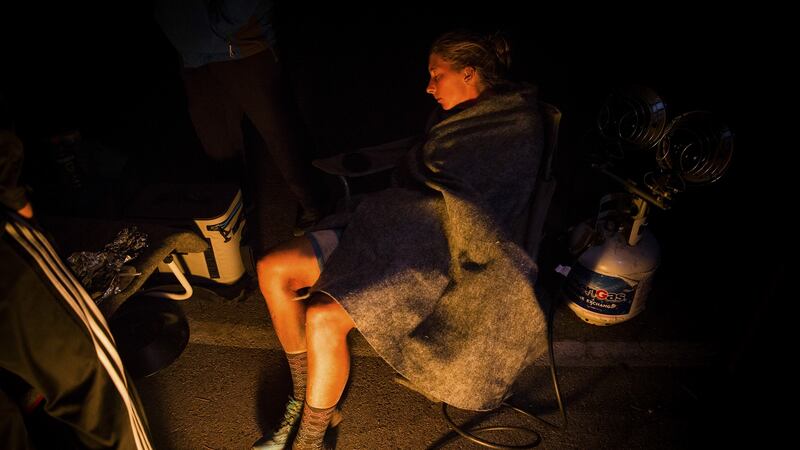 At 3.45 am, Courtney Dauwalter sleeps for a couple of minutes at the Loon Lake, California, aid station at mile 182 of the Tahoe 200 ultramarathon.