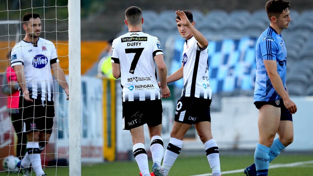 Dundalk’s Michael Duffy celebrates scoring the second goal of the game with Pat Hoban and Jamie McGrath. Photo: Ryan Byrne/Inpho