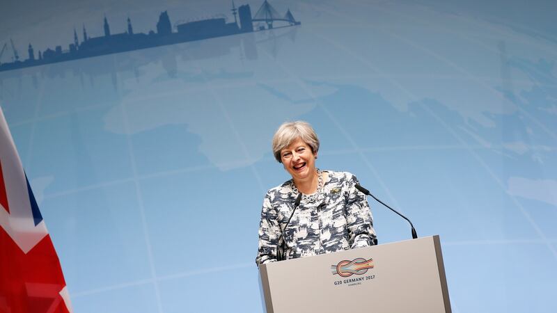 British prime minister Theresa May adopted a middle position on trade between the US and other G20 members, insisting that London stood by the status quo now and into the Brexit future. Photograph: Friedemann Vogel/EPA