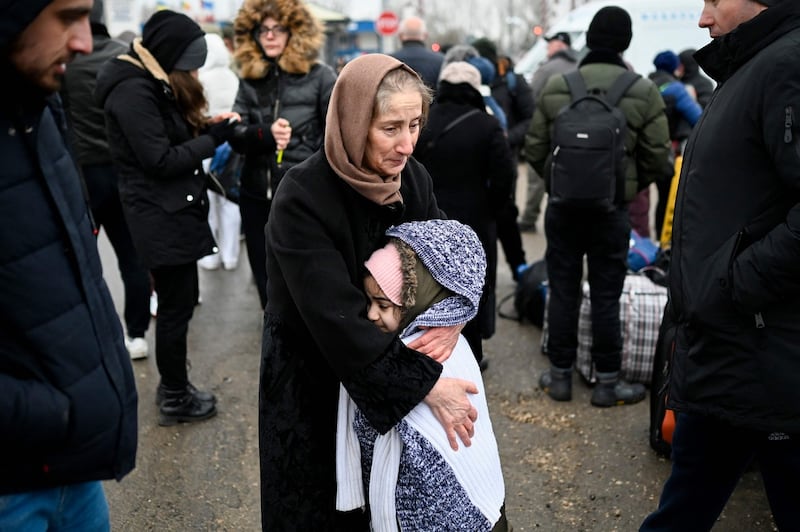 Refugees from Ukraine wait for transport at the Moldova-Ukraine border checkpoint near the town of Palanca. Photograph: Nikolay Doychinov/AFP/Getty