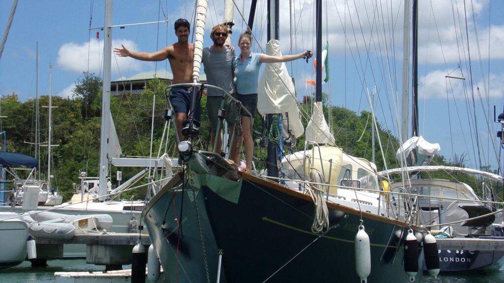 Claire McCluskey with her partner Nick Russell (centre) and crew member Sean on board Rogue Trader, before they set sail from Antigua. Photograph: David van der Möllers