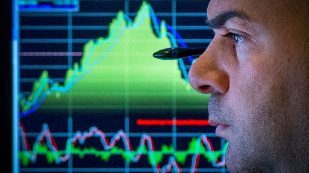A trader watches his screen on the floor of the New York Stock Exchange yesterday. US stocks fluctuated, after the Standard and Poor’s 500 Index produced its biggest two-day gain since April, as investors watched geopolitical developments and energy shares sank. Photograph: Reuters
