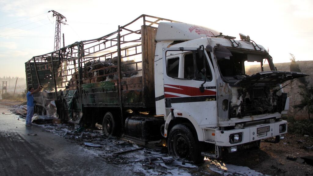 A damaged truck carrying aid is seen on the side of the road on the western outskirts of the northern Syrian city of Aleppo on September 20th, 2016, the morning after a convoy delivering aid was hit by a deadly air strike. Photograph: Omar Haj Kadour/AFP/Getty Images