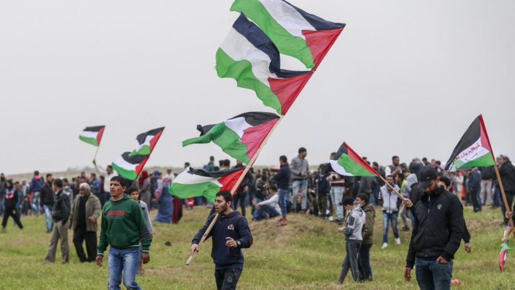 Palestinian protesters wave national flags during a demonstration marking the first anniversary of the March of Return protests, near the border with Israel east of Gaza City on March 30th. Photograph: Anas Baba/AFP/Getty