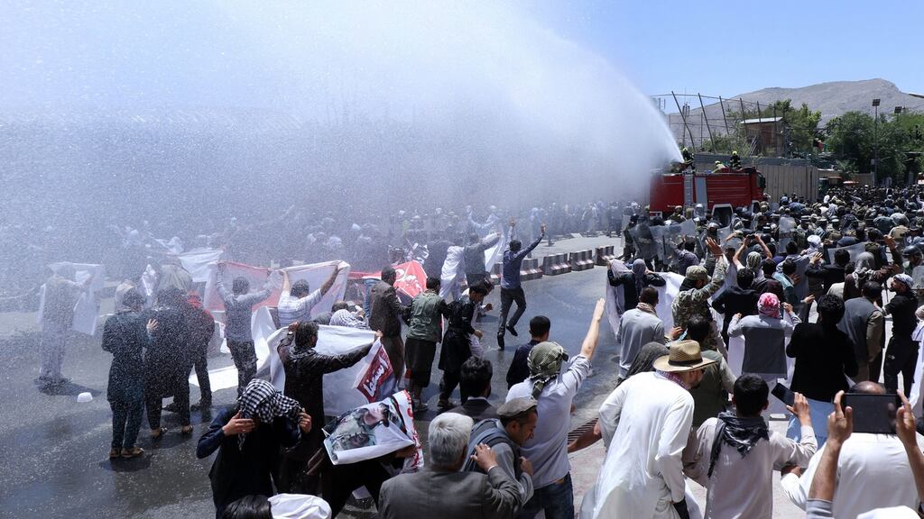 Afghan security officials use a water cannon to disperse demonstrators as they protest against a suicide bomb attack in Kabul, Afghanistan on Friday. Photograph: Hedayatullah Amid/EPA