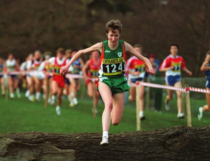 Catherina McKiernan jumps over a log during the inaugural women's European Cross Country Championship at Alnwick in Northumberland in 1994. McKiernan won the race, only seconds ahead of Julia Vaquero of Spain. Photograph: Anton Want/Getty Images