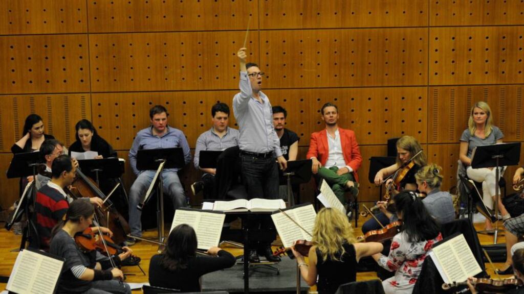 The RTÉ CO and conductor John Wilson in rehearsals for Carmen, with Irish mezzo Patricia Bardon (far right). Photograph: Clodagh Kilcoyne