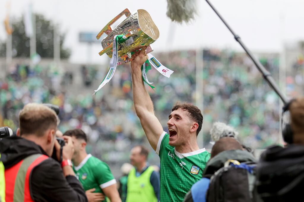 Limerick's Barry Nash celebrates with the Liam MacCarthy Cup after the game. Photograph: Laszlo Geczo/Inpho