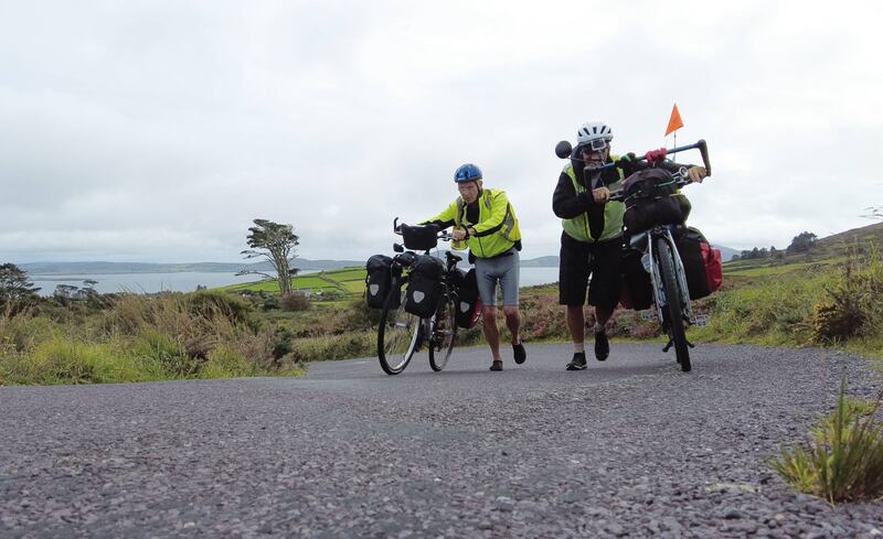 Jean-Luc and his friend Bernard climb a steep road in Co Cork