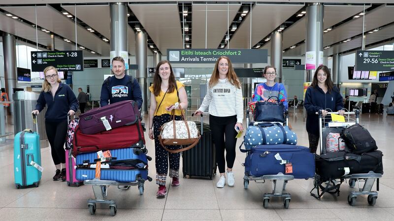 Doctors Aoife Page, Luke Hughes, Rachel Kearns, Hilary Coyle, Deirdre Ryan and Eva Tallon arrive back in Dublin Airport from Perth, Australia to help with the Covid-19 healthcare effort. Photograph: Crispin Rodwell for The Irish Times