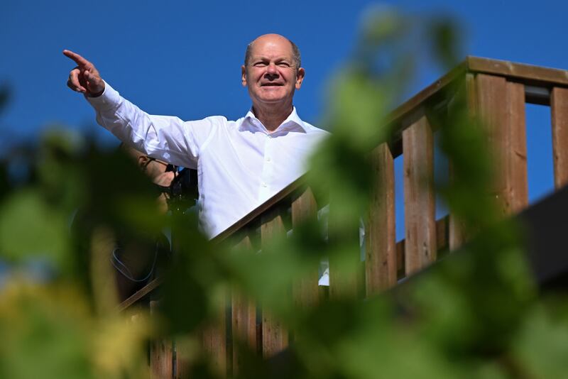 German Chancellor Olaf Scholz gestures as he visits the Wachtelberg vineyard in the town of Werder near Potsdam, capital of the eastern German state of Brandenburg, on Friday. Photograph: Ralf Hirschberger/AFP via Getty Images