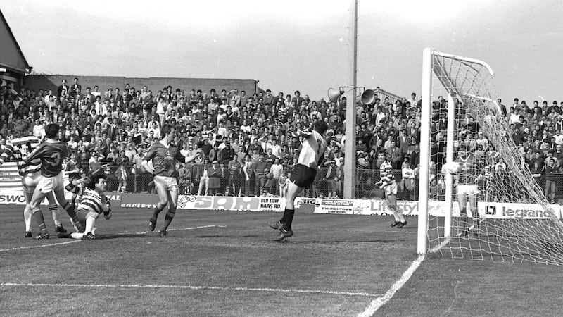 Mick Byrne beats Sligo Rovers goalkeeper Fred Davis to score for Shamrock Rovers in their last game at Milltown. Photograph: Eddie Kelly