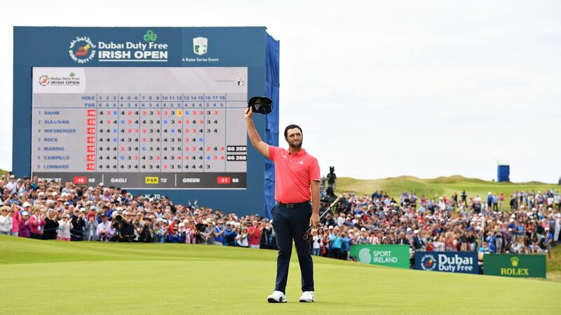 Spain’s  Jon Rahm  waves to the crowd after his putt on the 18th hole on the final day of the  Dubai Duty Free Irish Open at Lahinch Golf Club in July 2019. Photograph: Ross Kinnaird/Getty Images