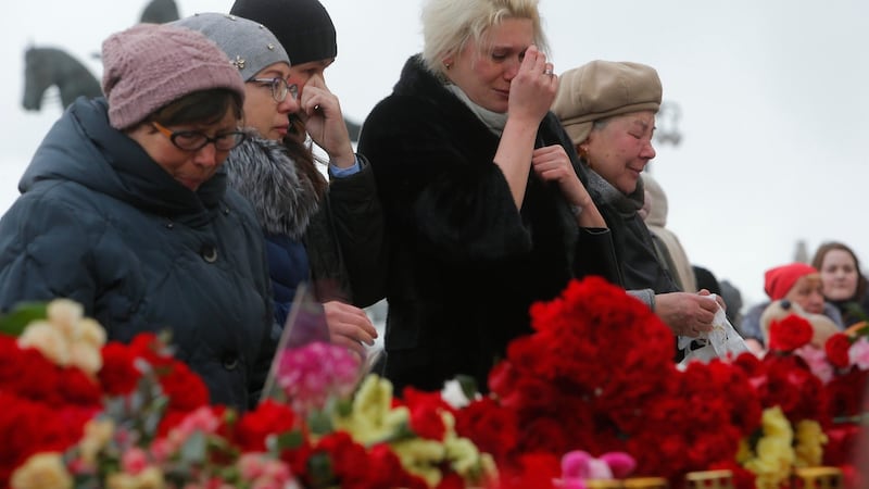People gather to commemorate the victims of a shopping mall fire in Kemerovo on the day of national mourning in central Moscow on Wednesday. Photograph: Sergei Karpukhin/Reuters