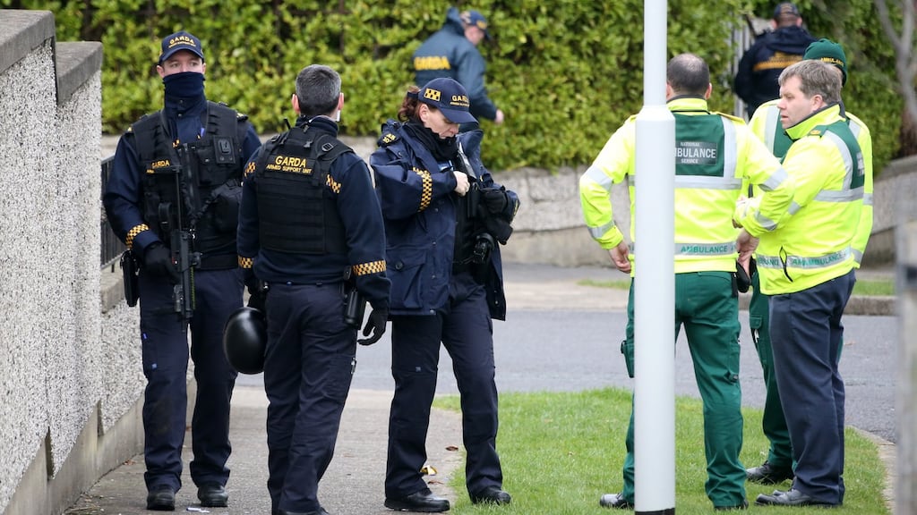 Armed gardaí and paramedics during a standoff at a house on Ballyogan Green in Dublin on Thursday afternoon. Photograph: Colin Keegan/Collins