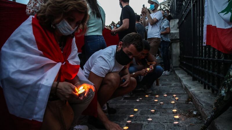 Members of the public light candles during the Solidarity Stand event in Paris, France, August 5th, 2020. Photograph: Mohammed Badra/EPA