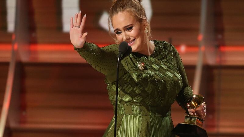 Adele waves to singer Beyoncé who is in the audience at the Grammys in Los Angeles. Photograph: Lucy Nicholson/Reuters