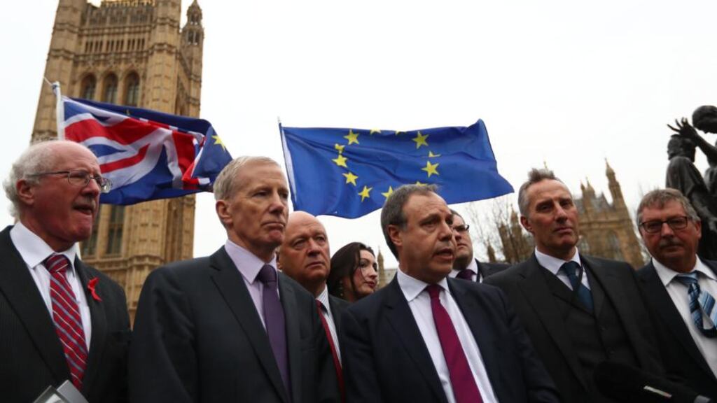 Deputy DUP leader Nigel Dodds (centre), and fellow DUP MPs, as Mr Dodds delivers a statement outside the Houses of Parliament in London. Photograph: Neil Hall/EPA
