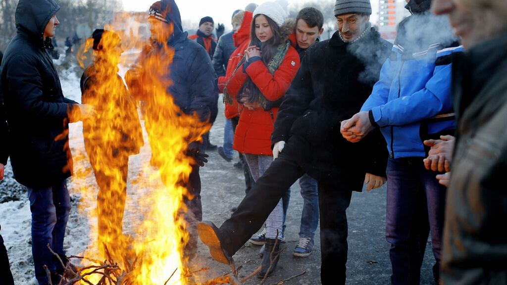 Protesters in the middle of a blocked motorway in Chisinau on Sunday. At least 15,000 people rallied in the capital in the latest demonstration against a government that was hastily approved by parliament and secretly sworn in late last Wednesday. Photograph: Robert Ghement/EPA