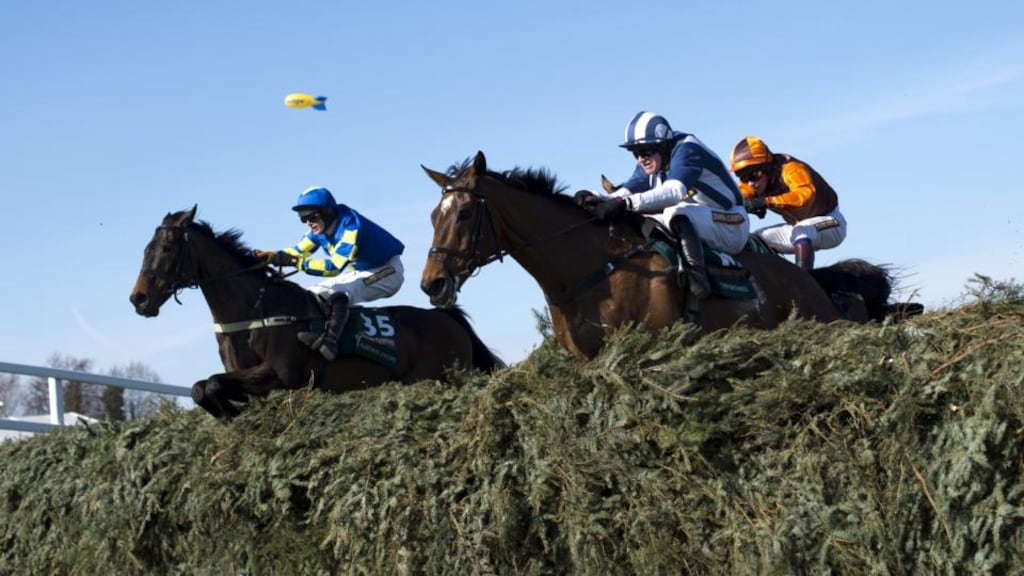 Teaforthree (foreground) jumps the last on the way to finishing third in the 2013 Grand National at Aintree. Photograph: Adrian Dennis/AFP/Getty Images.