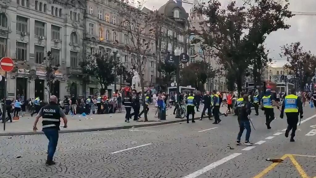 Screengrab from a video taken with permission from the Twitter feed of @_MattBrown of police and England fans clashing in the Portuguese city of Porto on Wednesday evening. Photo: Matt Brown/PA Wire