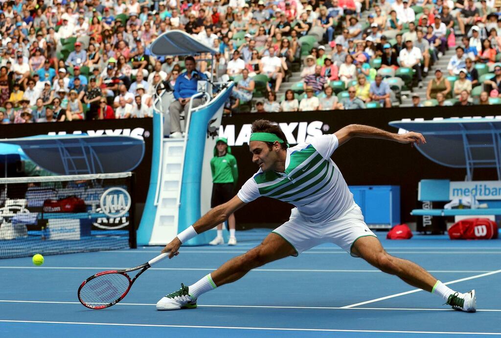 Switzerland’s Roger Federer stretches to hit a shot during his second round match against Ukraine’s Alexandr Dolgopolov at the Australian Open. Photograph: Jason O’Brien/Reuters