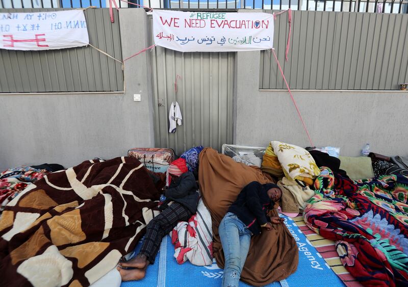 Refugees outside the UNHCR headquarters in Tunis in April 2022. Hundreds called for evacuation during a sit-in that lasted months. Photograph: Mohamed Messara/EPA