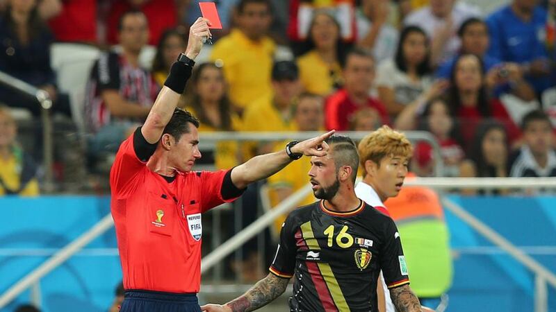 Belgium’s Steven Defour is shown a straight red card after a tackle on South Korea’s Kim Shinwook during the World Cup Group H match at Arena Corinthians in Sao Paulo. Photograph: Diego Azubel/EPA
