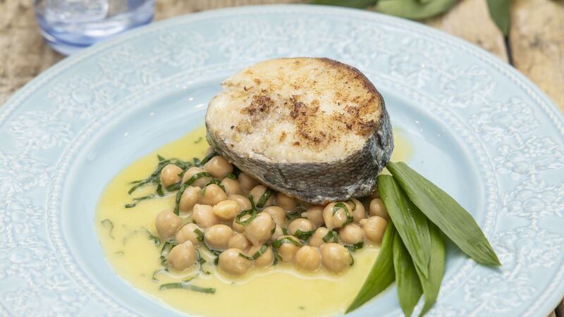 Hake chops with chickpeas and wild garlic butter sauce. Photograph: Harry Weir