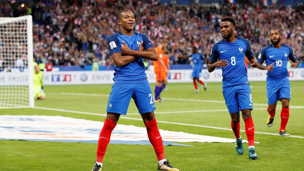 France’s Kylian Mbappe celebrates scoring with former Monaco teammate Thomas Lemar. Photograph: Reuters