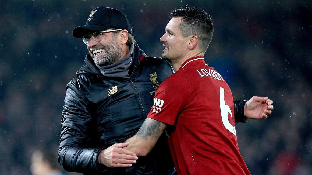 Liverpool manager Jurgen Klopp with Dejan Lovren at Anfield. Photograph: Peter Byrne/PA Wire