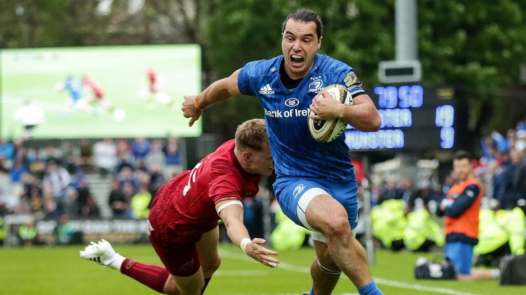 Leinster’s James Lowe evades Munster’s Mike Haley on his way to scoring a try in the  Guinness Pro14 semi-final  at the RDS, Dublin on Saturday. Photograph: Laszlo Geczo/Inpho